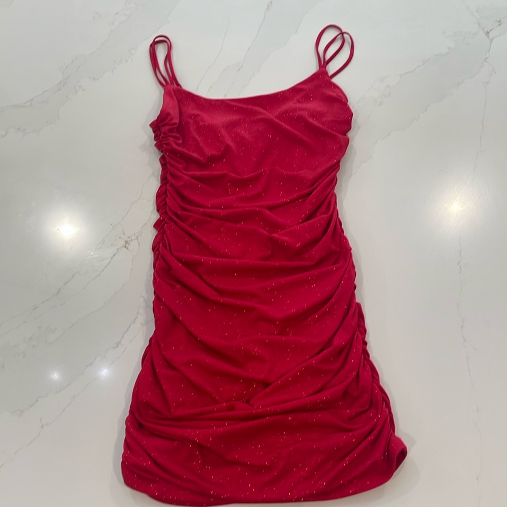 Red mini “Lucy in the Sky” dress with sparkles.